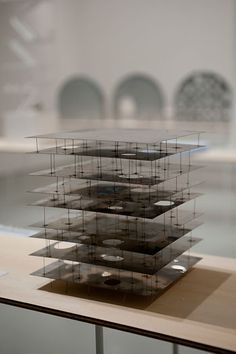 a stack of books sitting on top of a wooden table