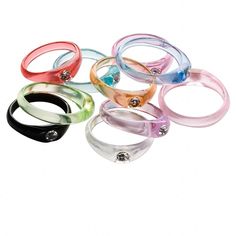 six different colored rings with crystal stones on them