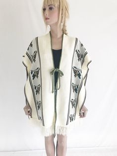 Beautiful vintage 70's poncho. Soft knit fabric. Off white/ cream color. Fabulous, bird print. Ties in front. Clean and ready to wear. In excellent vintage condition! Size: free size Military Combat Boots, Black Velvet Blazer, Vintage Military, Bird Print, Bird Prints, White Cream, Soft Knits, Vintage 70s, Cream Color