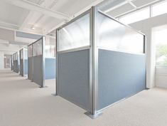 an empty room with several partitions in it