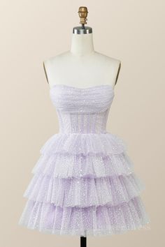 Lavender tulle with a starry appeal, a see-through corset bodice with a strapless neck and boning that holds! It's an A-line silhouette with a zippered back and tiers of ruffles that keep it short (above the knee, 'fess up!). Lavender Color Tullematerial with stars See-through corset bodice with strapless neck, and boning A-linesilhouette Zip-up back Tiered ruffles short skirt Above kneelength Built-in bra Care: hand wash only For custom size, email us your measurements: bust, waist, hips, and h Hoco Dresses Enchanted Forest Theme, Pastel Purple Hoco Dress, Fairytale Dresses Short, Trendy Winter Formal Dresses, Small Prom Dresses Short, Sparkly Puffy Dress, Snow Ball Dresses Short, Pink Corset Hoco Dress, Hoco Dresses Fairytale