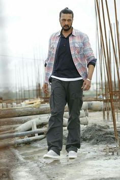 a man standing in front of construction materials