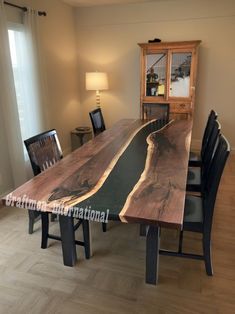 a wooden table with chairs around it