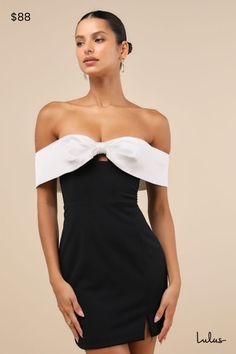 Simply captivate any room you walk into with a mesmerizing look like the Lulus Extravagant Moment Black and White Off-the-Shoulder Mini Dress! This stretchy crepe knit dress starts with a white, satin bow-shaped overlay that creates a chic off-the-shoulder neckline that has hidden no-slip strips and continues into short sleeves (with elastic at the shoulders). Seamed bodice with a dainty keyhole cutout at the center and a fitted waist sits atop a figure-flaunting bodycon skirt that finishes at a Black And White Strapless Dress, Short Black And White Wedding Dress, Black And White Homecoming Dress, Short Off Shoulder Wedding Dress, Black Semi Formal Dresses, Uga Outfits, Homecoming Dresses Off The Shoulder, Classy Dresses Short, Cocktail Dress Modest