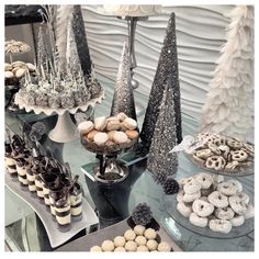 a table topped with lots of desserts and cookies