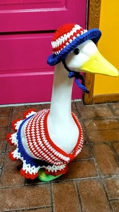 a white duck wearing a red, white and blue hat