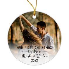 a christmas ornament with an image of a man and woman holding each other