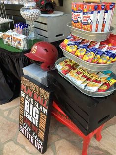 an assortment of snacks on display at a baseball themed party