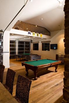 a pool table in the middle of a room