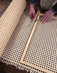 a person is working on an area rug