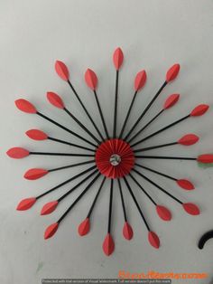 a clock made out of red and black arrows