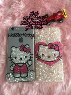 two cell phones with hello kitty designs on them