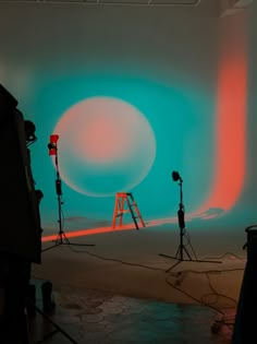 an image of a camera set up in front of a blue and red background with lights