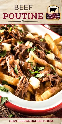 the beef poutine is served in a red and white bowl with parsley on top