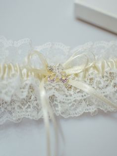 Pretty wedding garter with crystal detailing closeup TLG512  #Garter #bridalgarter #weddinggarter #lacegarter #ivorygarter #weddingideas Bridal Garter Lace, Wedding Garter Lace, Christmas Stockings Diy