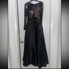 One Piece Long Gown Perfect For A Gala Or A Formal Event. Size 6p. Purchased For $299. Black And Goldmaybe More Of A Champagne Color. Long Sleeves. Stretch Tight On Top And Flows On Bottom. Evening Embellished A-line Gown, Fitted A-line Gown With Sequins, Formal A-line Evening Dress With Sequins, Black A-line Gown For Formal Occasions, Black Embellished A-line Evening Dress, Long Sleeve Evening Mother Of The Bride Dress, Dressy Long Sleeve Evening Gown, Holiday A-line Prom Gown, Dressy Evening Maxi Dress In Floor-length