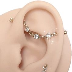 a pair of ear piercings on top of a dummy