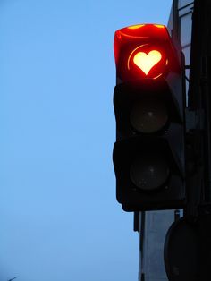 a traffic light with a heart painted on it