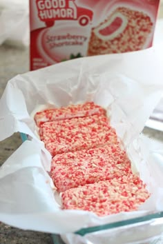 some kind of cake that is sitting in a pan on the counter next to a box of good humor