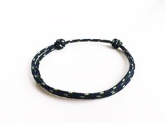 Nautical halyard cord or also called lanyard cord bracelet. - NAVY speckled white and yellow. Lucky bracelet to slip while making a wish. o Cord Thickness (diameter): 0.1 in (2 millimeters). o SIZE suitable for everyone thanks to its sliding knots (its circumference is approximately 4.7 inches (12 centimeters) when it is tightened to the maximum and 9 inches (23 centimeters) when it is fully open)! Do not hesitate to contact me if you think you need a specific size (for a baby, a child, a teenager or even a small or a very large wrist). △ o △ In the concern of the perfect detail, my slip knots are made with great care and I burn them to make an extreme resistance. △ o △  Bracelet highly resistant to be worn 24/24. Perfect for women, men and teens! It is a lucky charm bracelet. Thank you an Man Bracelet, Lucky Charm Bracelet, Lucky Bracelet, Cord Bracelet, Sliding Knot, Cord Bracelets, Braided Bracelets, Lucky Charm, Make A Wish