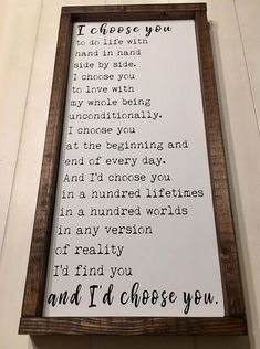 a wooden framed sign with the words i'd choose you to be loved by someone else