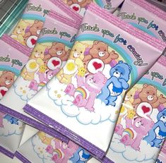 there are many pink and blue bears on the paper bags that say thank you for being loved