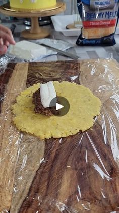 a tortilla being prepared on a cutting board