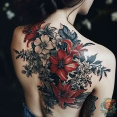 the back of a woman's shoulder with flowers on her left arm and chest