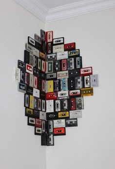 a bunch of cassette tapes are arranged in the shape of a sunburst on a wall