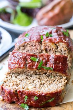 two slices of meatloaf on a cutting board