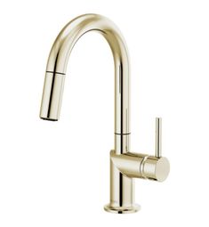 the brass faucet is shown with black handles