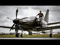 a man standing on the wing of an airplane