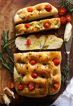 three slices of bread with tomatoes and herbs