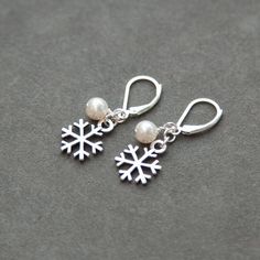 Sterling Silver Snowflake Earrings Pearl by SprigJewelry on Etsy Elegant Winter Jewelry As Gift, Elegant Holiday Dangle Earrings, Elegant White Christmas Earrings, Elegant Festive Jewelry For Winter, Elegant Christmas Anniversary Earrings, Holiday Silver Drop Earrings, Holiday Silver Jewelry With Ear Wire, Silver Holiday Drop Earrings, Elegant Snowflake Jewelry For Festive Occasion