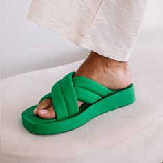 Stay comfy in style in these vegan puffy crisscross sandals in white, with synthetic leather lining, comfortable padded insole, and easy slip-on style. Shop Now!