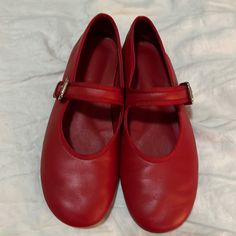 Color: Ruby Nappa Material: Leather Worn A Few Times, Excellent Condition Red Round Toe Mary Janes For Formal Events, Formal Red Leather Mary Janes, Red Leather Mary Janes With Flat Heel, Red Closed Toe Mary Janes With Buckle Closure, Red Leather Mary Janes With Low Heel, Red Mary Janes With Buckle Closure And Round Toe, Red Mary Janes With Buckle Closure, Red Leather Round Toe Mary Janes, Red Leather Shoes With Round Toe