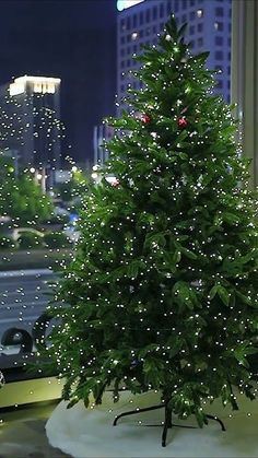 a small christmas tree sitting on top of a table