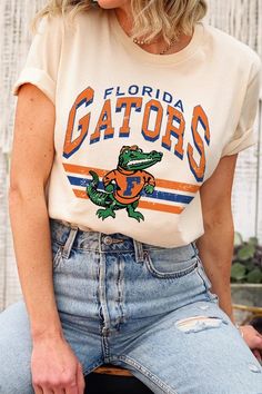 FLORIDA GATORS,FOOTBALL UNISEX SHORT SLEEVE,GRAPHIC TEE,GRAPHIC TSHIRTS,TSHIRTS,TEES100%COTTON,HEATHER(52%COTTON,48%POLY),ATH.HEATHER,BLACK HEATHER(90%COTTON,573%POLY)NICARAGUAMade In: Nicaragua Florida Gators Football, Gators Football, Essential Oil Accessories, Plus Swimwear, Florida Gators, Skirted Swimwear, Unisex Shorts, Heather Black, T Shirt Top