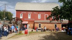 people are standing in line to enter the tates cider mill