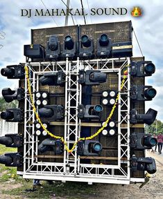 there are many speakers stacked on top of each other in front of a sign that says dj mahaki sound