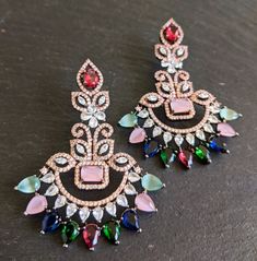 Elegantly Made Just the right size floral chandbali earrings with striking CZ earrings in assorted shapes and tear drop multi color stones Length: 2.5 Inches Width: 1.95 Inches Bridal Indian, Chandbali Earrings, Color Stones, Indian Earrings, Cz Earrings, New Market, Tear Drop, Bridal Earrings, Jewelry Earrings Dangle