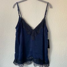 Super Cute And Soft Lace Cami. Lace Part Is Black And The Rest Of The Cami Is Navy Blue. New With Tag! Chic Cami Top For Night, Chic Night Cami Top, Chic V-neck Top For Night, Blue Camisole Top For Night, Lace Trim Camisole Top For Date Night, Date Night Camisole Top With Lace Trim, Date Night Lace Trim Camisole Top, Date Night Cami Top With Lace Trim, Lace Trim Cami Top For Date Night