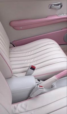 the interior of a car with pink trim and white leather upholstered seat covers