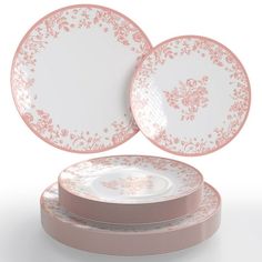 pink and white plates stacked on top of each other in front of a white background