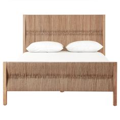 the headboard and foot board are made from wood, with white pillows on top