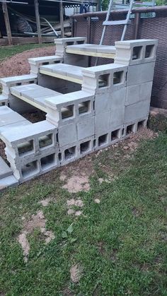 several concrete steps are placed in the grass