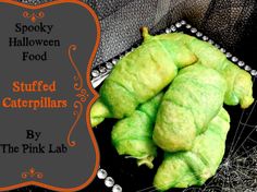 stuffed caterpillars are on display in front of a black background with the words spooky halloween food