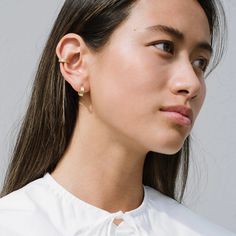 A SMALL BUT STRONG EAR ACCENT WHAT IT IS: An accent ear cuff in gold vermeil WHY IT’S SPECIAL: It's a small but significant accent Allows you to easily and comfortably update your ear game GOOD TO KNOW: Yellow Gold vermeil Diameter: 12mm WHY WE LOVE KARA YOO: Kara Yoo plays with geometric shapes and reinterprets classics with a fresh spin—it’s definitely not your mother’s pearls. Her unique and delicate designs are all handmade in Canada with recycled metals, vintage pearls and gemstones. What’s Faux Piercing, Ear Party, Keshi Pearls, Vintage Pearls, Hollywood Glamour, Pearl Studs, Boutique Jewelry, Gold Vermeil, Geometric Shapes