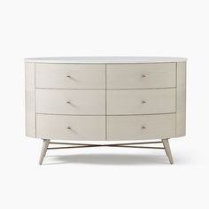 a white dresser with six drawers and two legs