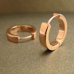 Large rose gold hoops for men in 12mm diameter. These men's hoops are made from sterling silver and plated in rose gold. At 3mm wide, they give a masculine and simple look. SPECIFICATION Base metal: Recyclable fine 925 Sterling Silver Outer layer: Shiny 18K rose gold, thick coating Outer diameter: 17mm Inner diameter: 13mm (size L) Width: 3.5mm Ear Post: 20G, standard Other sizes Medium hoops https://www.etsy.com/listing/57976444 Large hoops https://www.etsy.com/listing/54462674 Extra large hoop Rose Gold Polished Finish Huggie Earrings For Gift, Rose Gold Polished Huggie Earrings For Gift, Rose Gold Huggie Earrings With Polished Finish As Gift, Gift Rose Gold Huggie Earrings With Polished Finish, Rose Gold Polished Finish Hoop Earrings As Gift, Rose Gold Polished Hoop Earrings As Gift, Infinity Hoop, Men's Earrings, Hoop Earrings Large